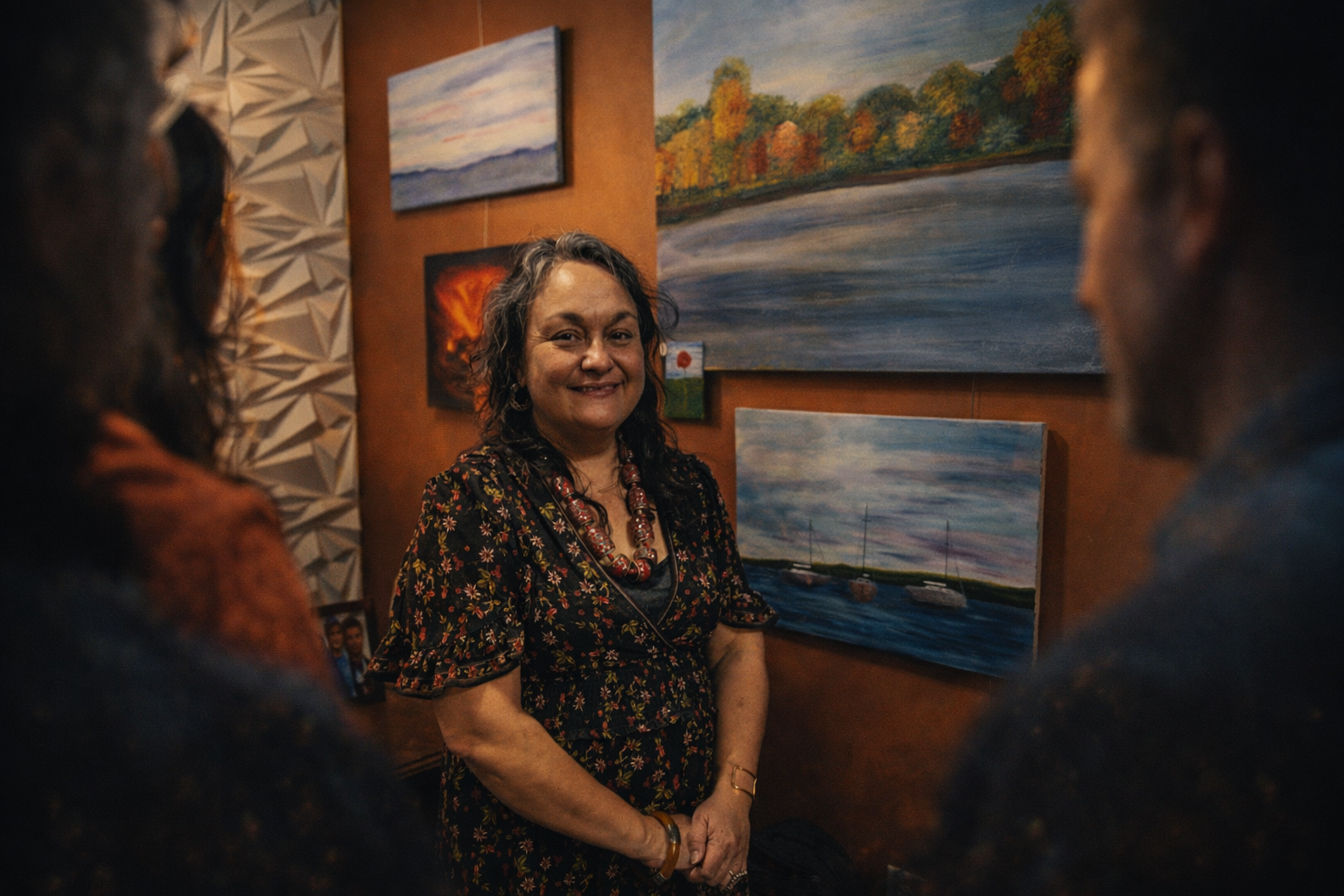 The Artist showing her work — Showing a selection of paintings